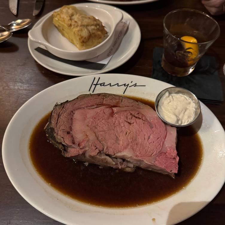 Harry’s Savoy Grill signature dishes Slow-Roasted Prime Rib, Crab Cakes, Pan Seared Scallops, extensive wine list